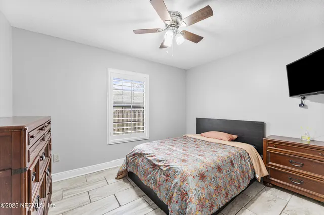 a view of a porch with a table and chairs