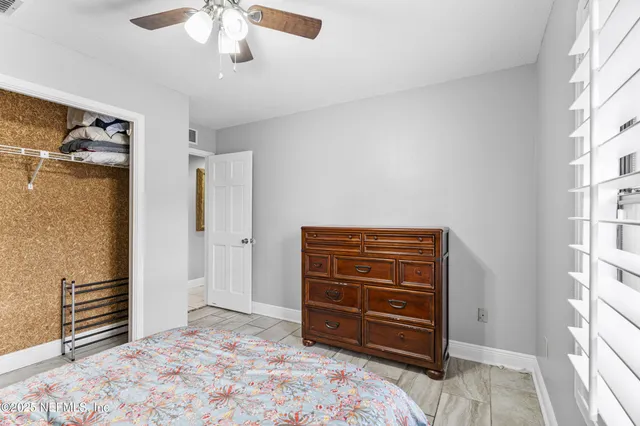 a view of a dining room with furniture and a potted plant