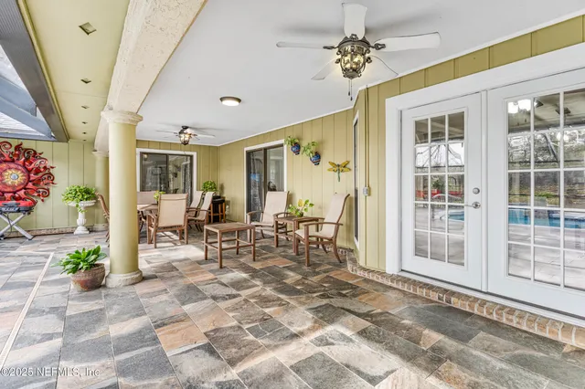 a front view of a house with garden and patio