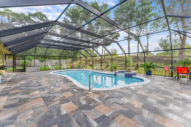 a view of a swimming pool with a patio