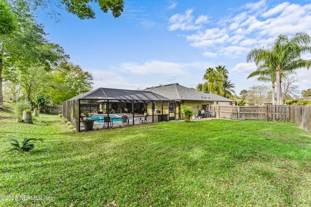 a aerial view of a house with garden space and street view