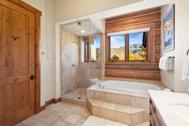 a bathroom with a tub and shower