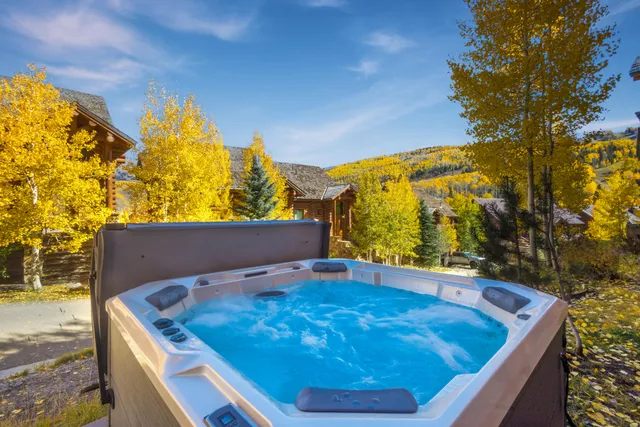 a view of a pool in the backyard of a house