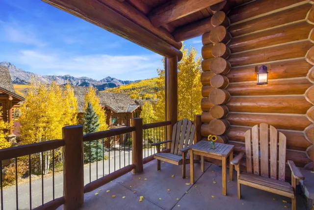 a view of a chairs and table in patio