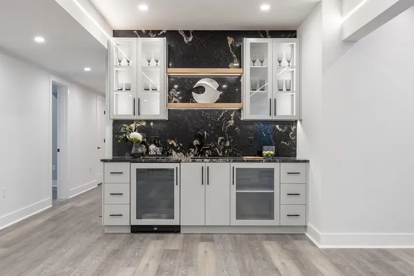a kitchen with stainless steel appliances a stove and cabinets