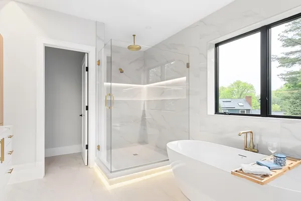 a bathroom with a tub and a shower