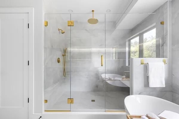 a bathroom with a shower and a sink