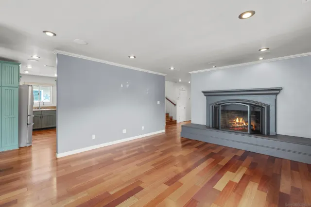 an empty room with windows and entrance