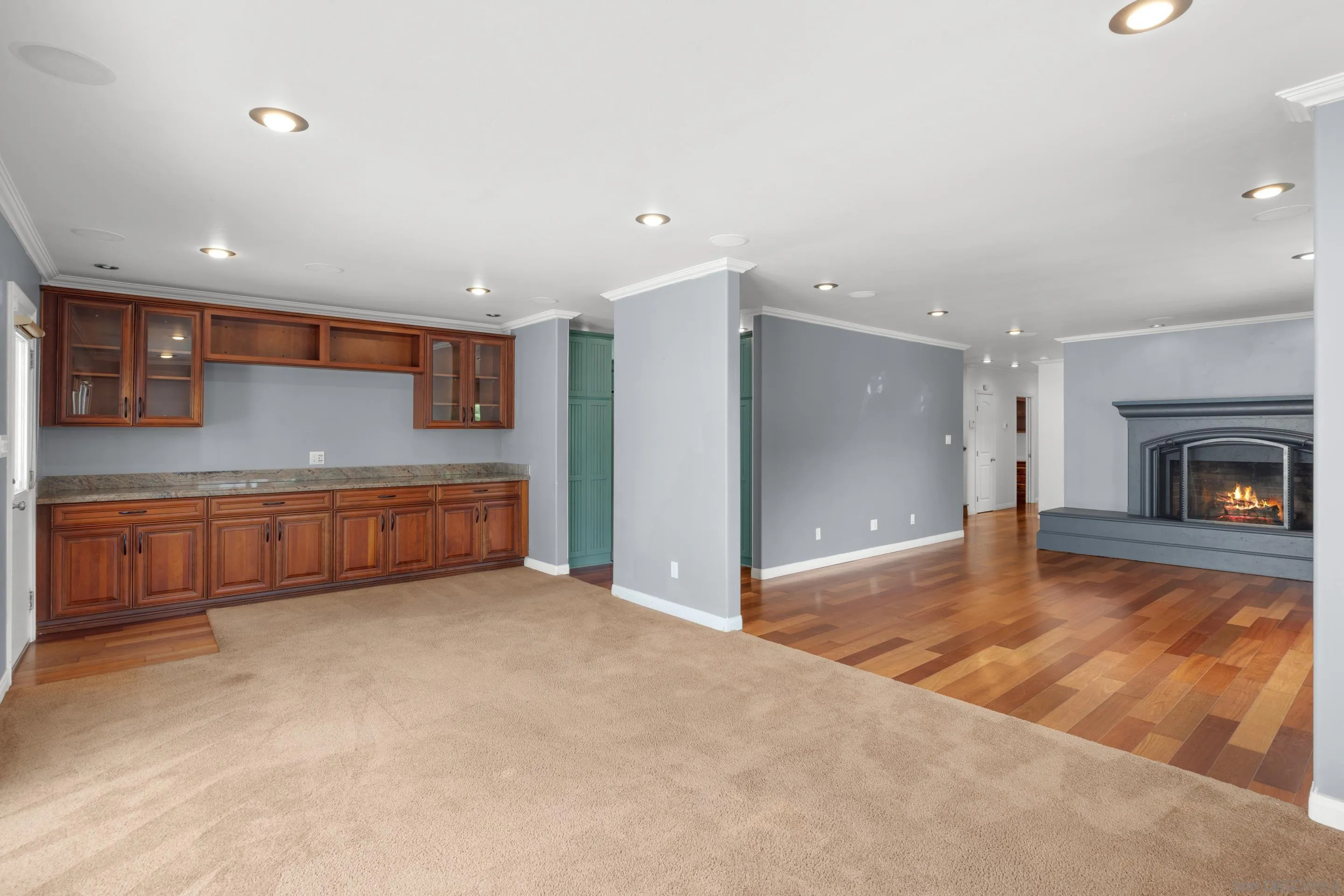 4975 Dawes Street San Diego, CA 92109 - Photo 15 of 39 a view of an empty room with a fireplace and a window