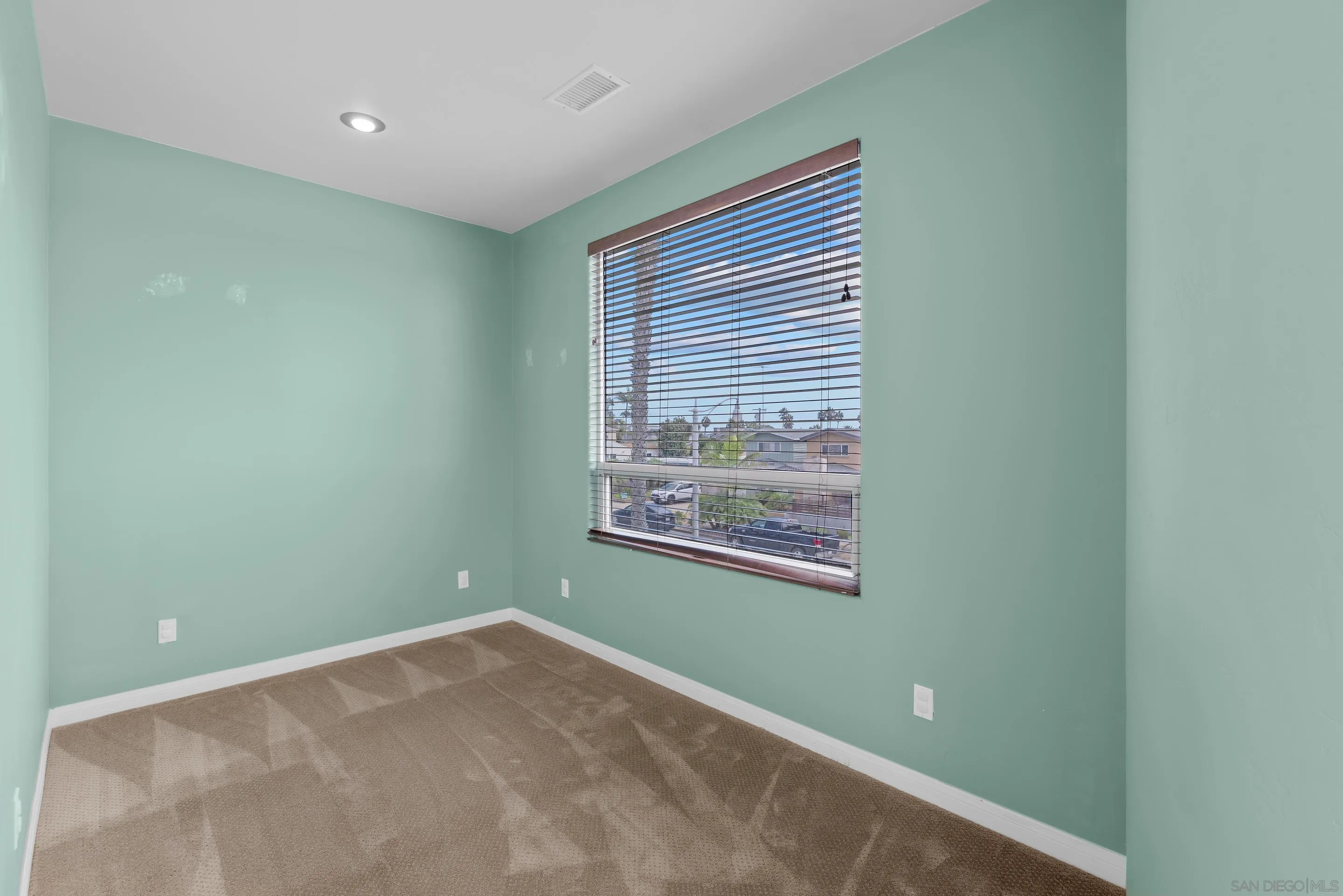 4975 Dawes Street San Diego, CA 92109 - Photo 22 of 39 a view of an empty room with a window