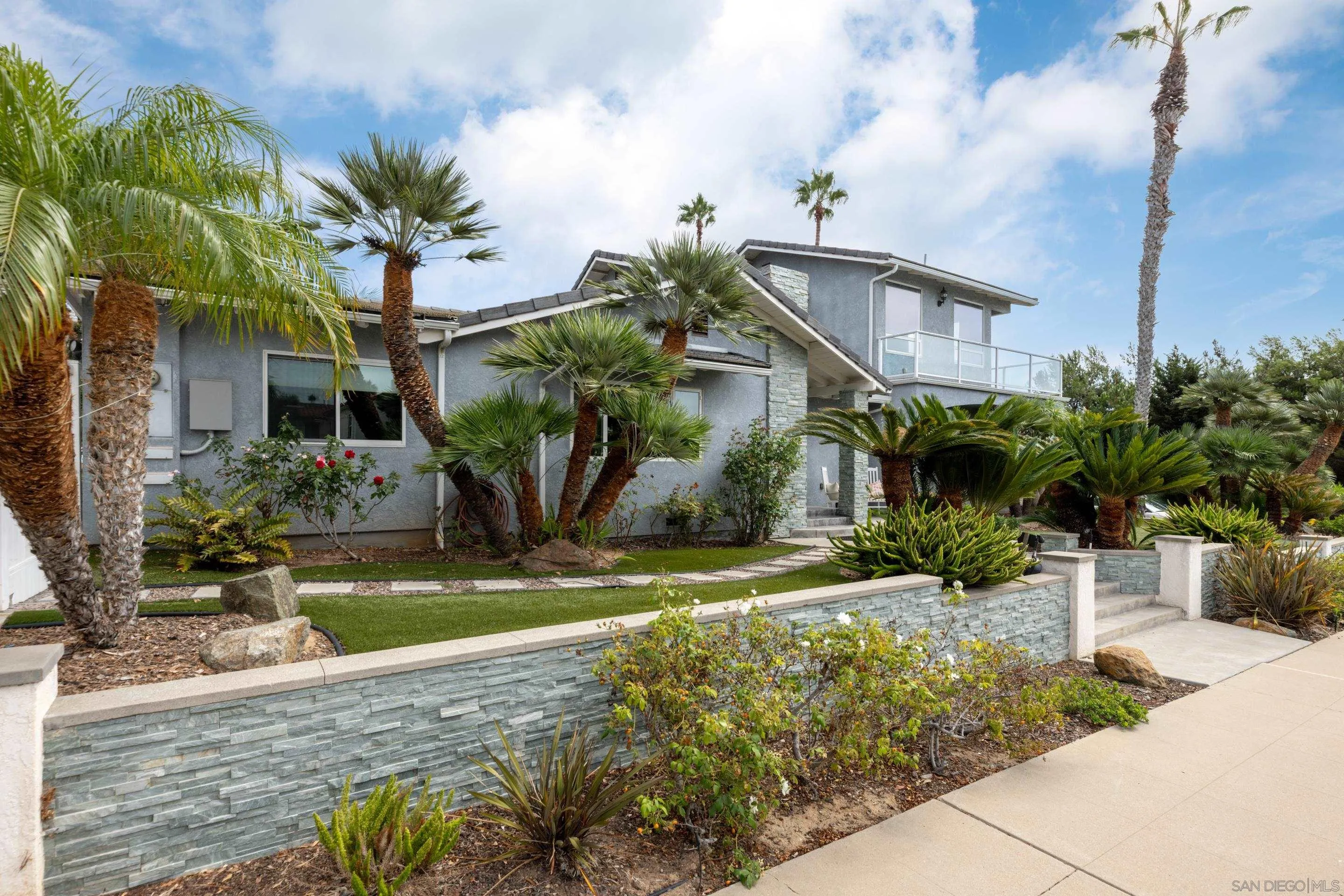 4975 Dawes Street San Diego, CA 92109 - Photo 3 of 39 a front view of a house with garden