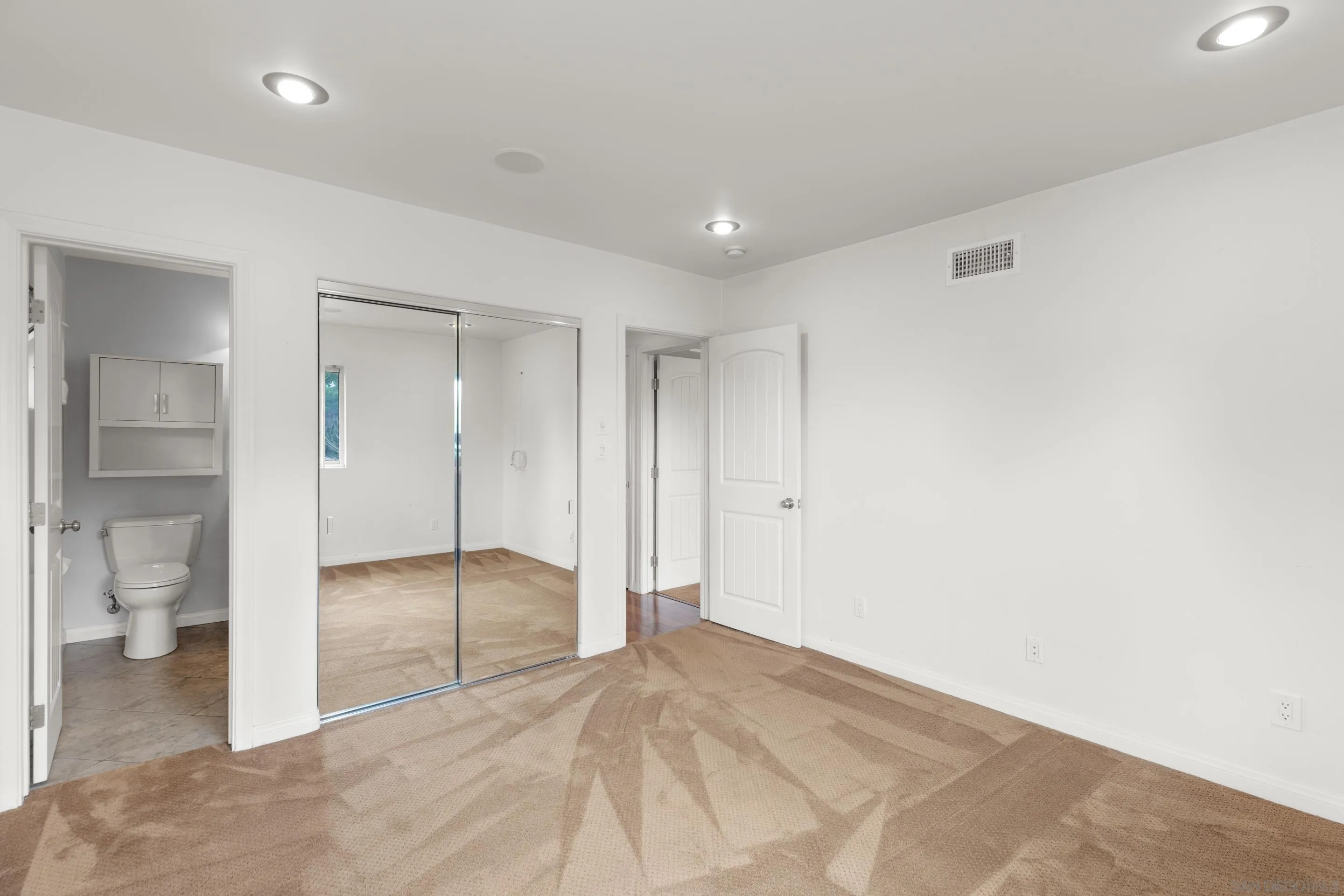 4975 Dawes Street San Diego, CA 92109 - Photo 35 of 39 a view of an empty room and a bathroom