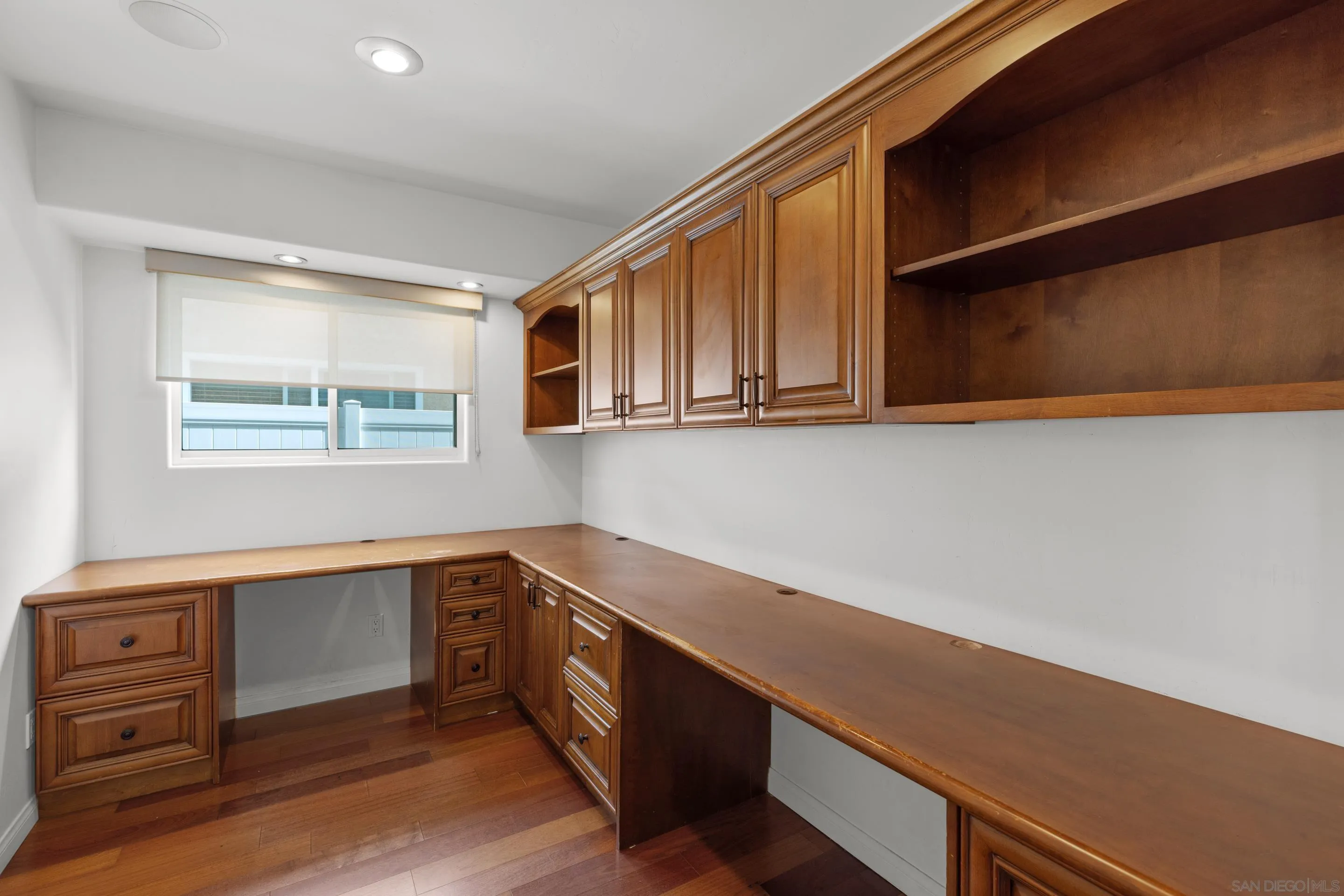 4975 Dawes Street San Diego, CA 92109 - Photo 37 of 39 a view of cabinets with wooden floor and window