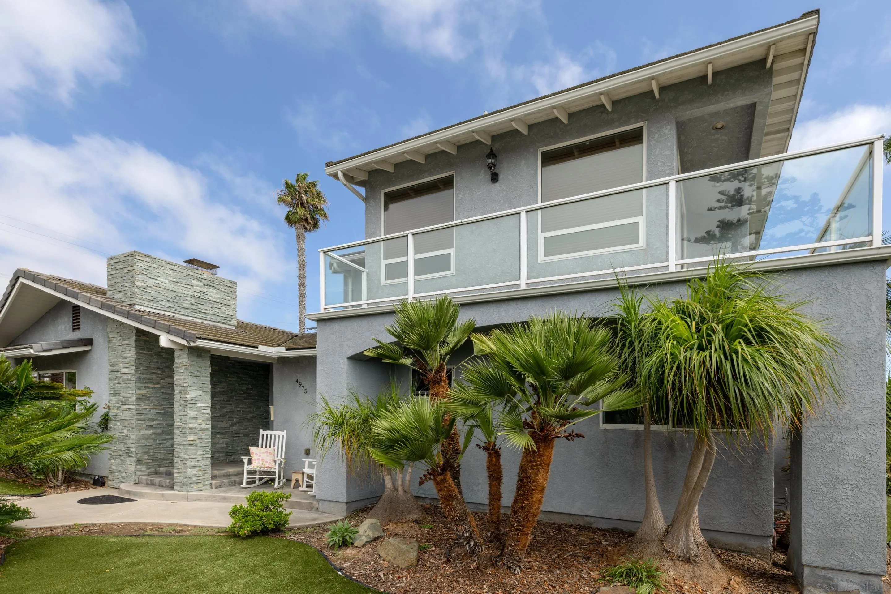 4975 Dawes Street San Diego, CA 92109 - Photo 7 of 39 a front view of a house with garden