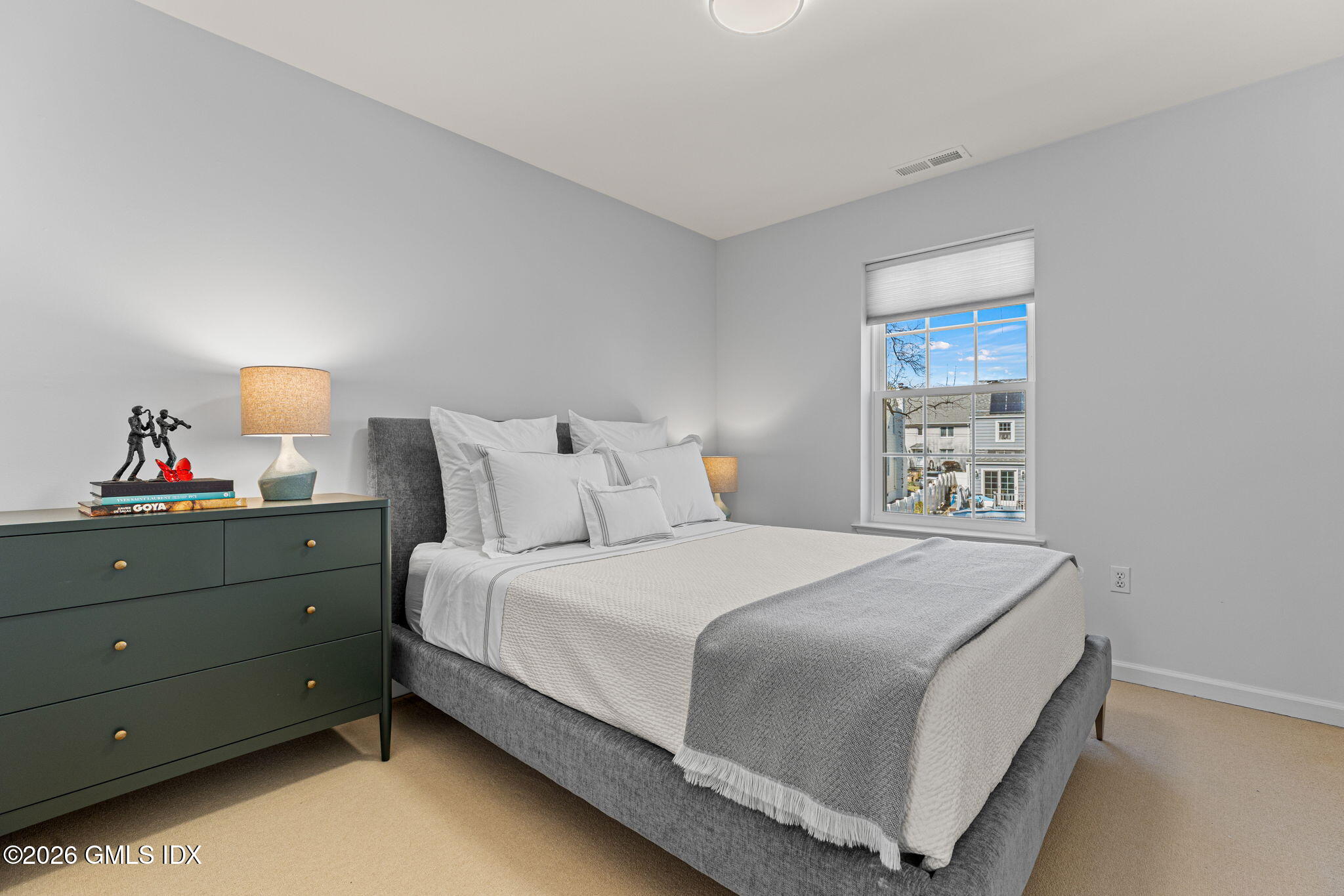 115 Top Gallant Road, Unit 6 Stamford, CT 06902 - Photo 12 of 18 a bedroom with a bed and a window