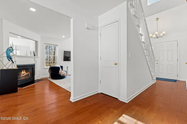 a view of a living room with furniture and a fireplace