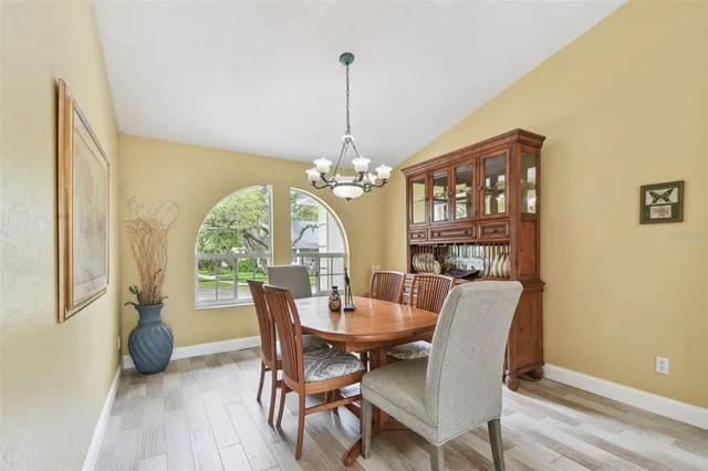 a view of a livingroom with workspace and a window