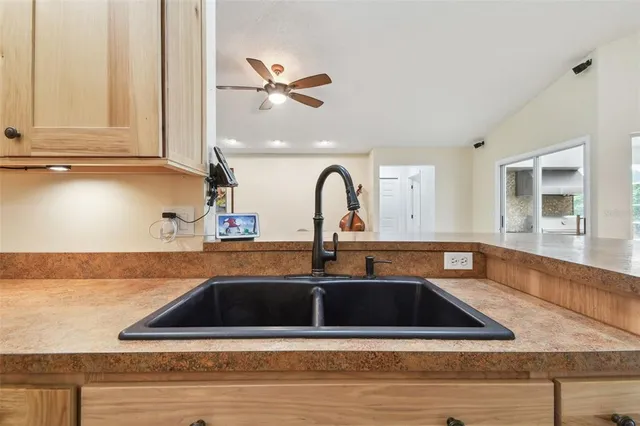 a bath room with a toilet a sink and a mirror