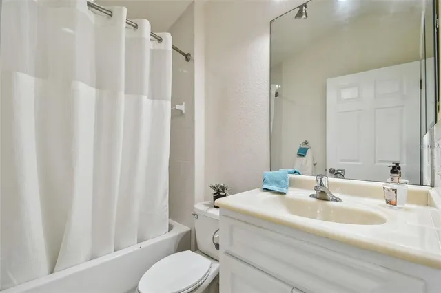 a bathroom with a sink vanity and a mirror