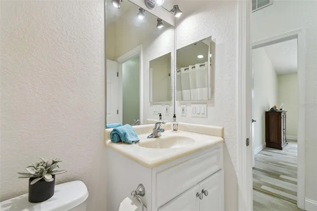 a bathroom with a tub a sink and a shower