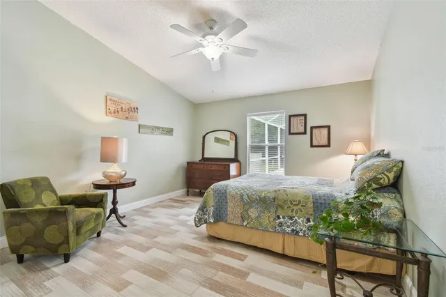 a view of a house with backyard and porch