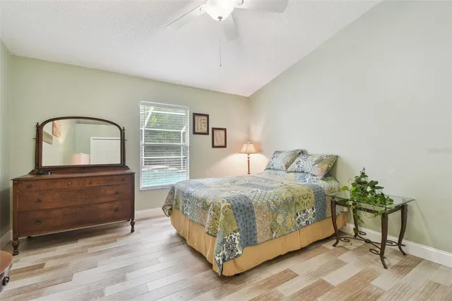 a view of a house with a backyard and porch