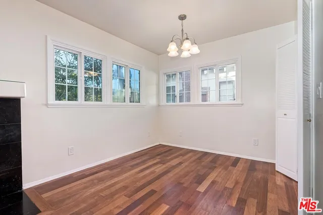 a large kitchen with stainless steel appliances granite countertop a stove a sink and a refrigerator