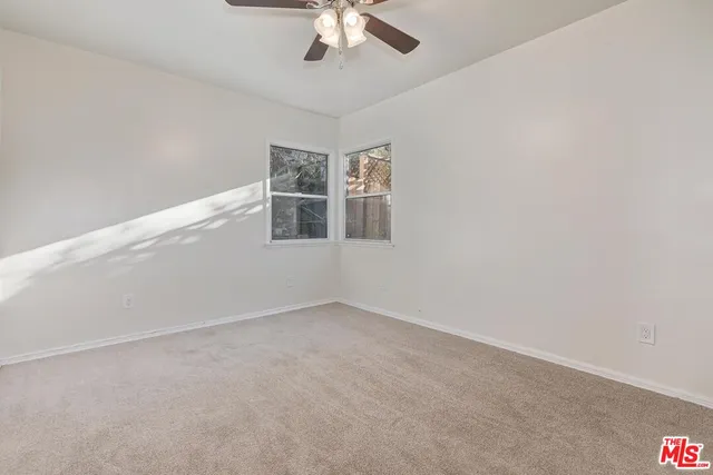 a view of empty room with windows