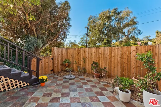 a view of a dinning room with a backyard and plants