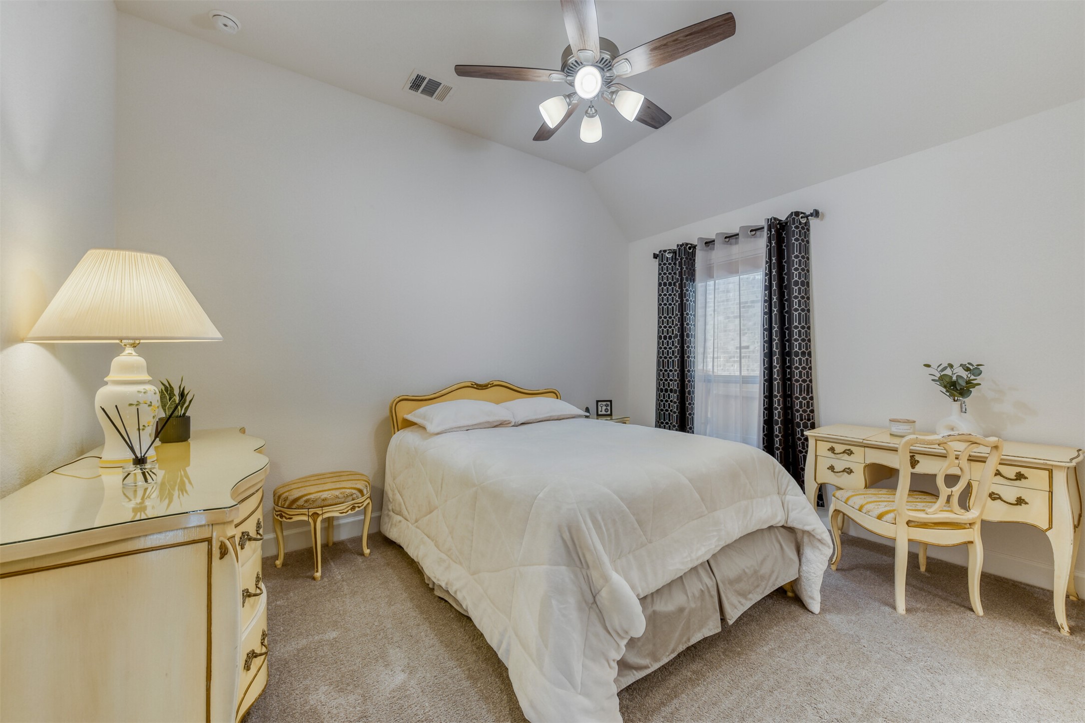 345 Prickly Poppy Loop Kyle, TX 78640 - Photo 18 of 28 Bedroom with lofted ceiling, light colored carpet, and a ceiling fan