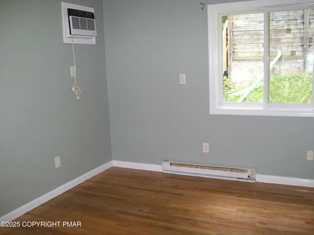 a bathroom with a granite countertop shower sink and mirror