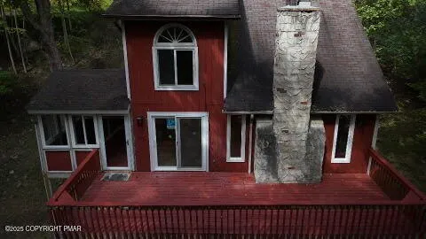 a view of balcony with wooden floor
