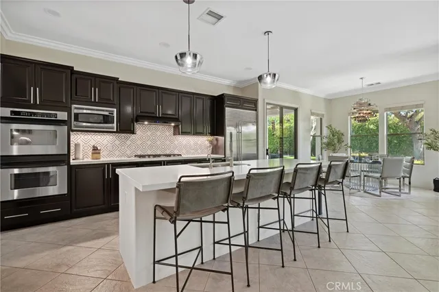 a room with pool table and windows