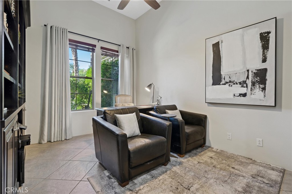 79690 Rancho San Pascual La Quinta, CA 92253 - Photo 18 of 73 a living room with furniture and a flat screen tv