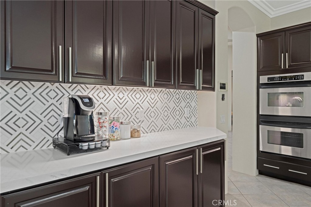 79690 Rancho San Pascual La Quinta, CA 92253 - Photo 22 of 73 a kitchen with a sink and cabinets