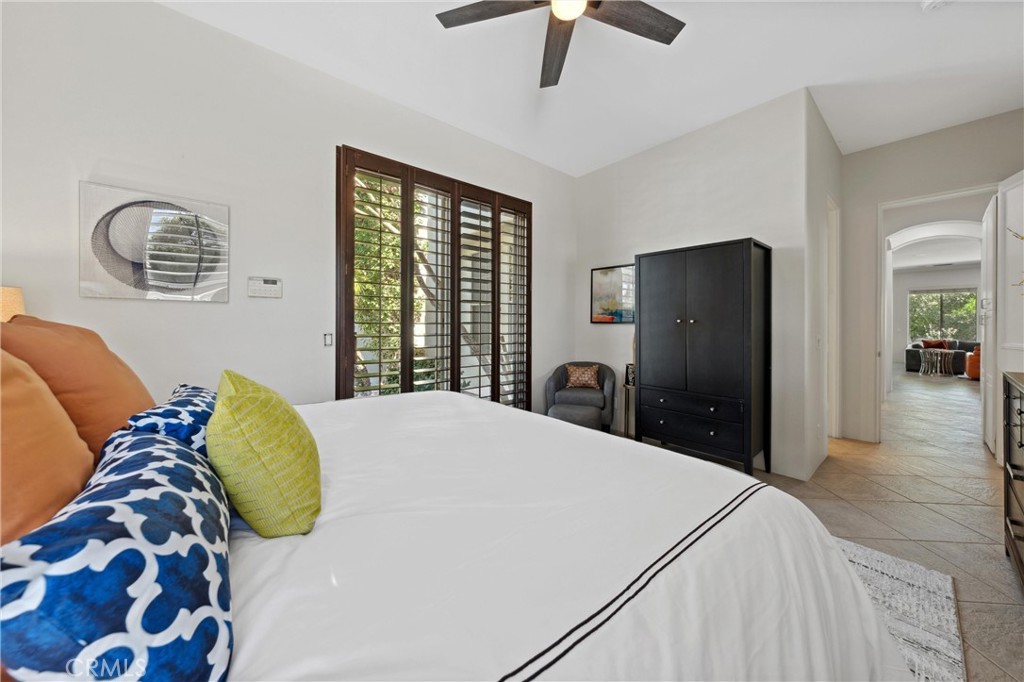 79690 Rancho San Pascual La Quinta, CA 92253 - Photo 35 of 73 a bedroom with a bed and a lamp