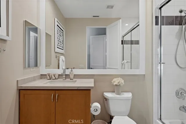 a view of a patio with table and chairs and potted plants