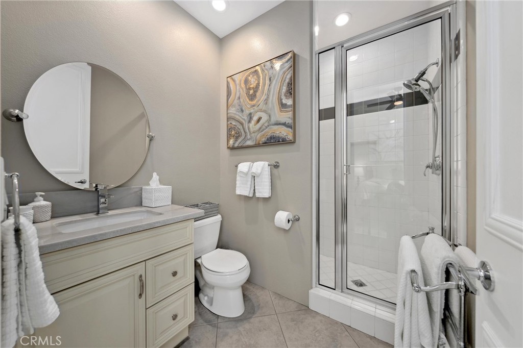 79690 Rancho San Pascual La Quinta, CA 92253 - Photo 39 of 73 a bathroom with a toilet a sink and mirror