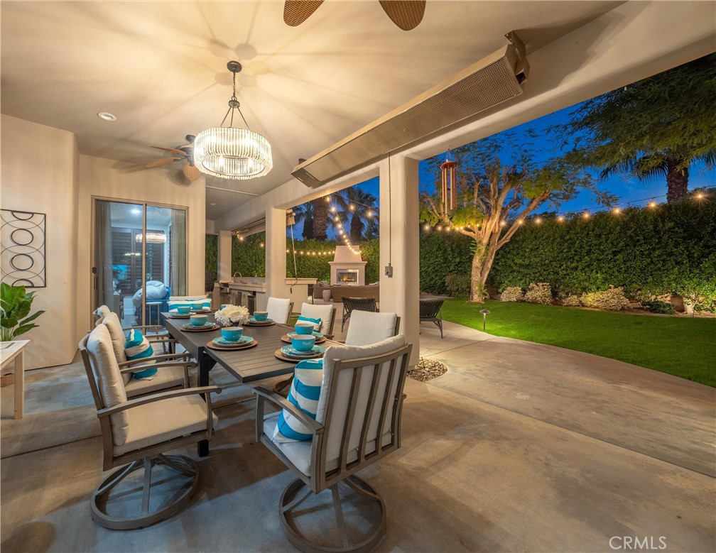 79690 Rancho San Pascual La Quinta, CA 92253 - Photo 47 of 73 a view of a patio with a table chairs and a yard