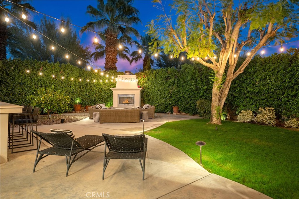 79690 Rancho San Pascual La Quinta, CA 92253 - Photo 58 of 73 a view of a patio with a table and chairs and a fire pit