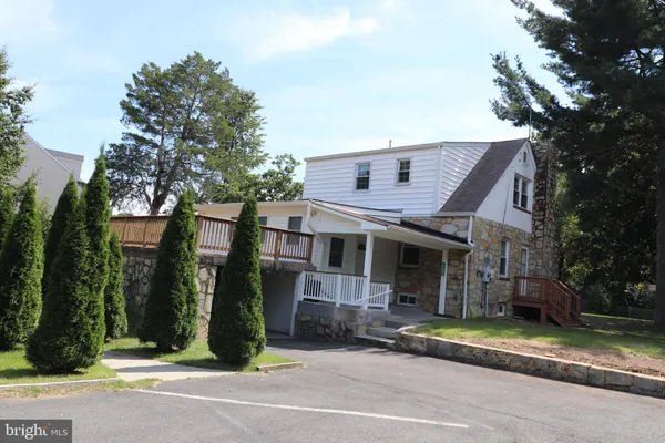 a view of a house with a street