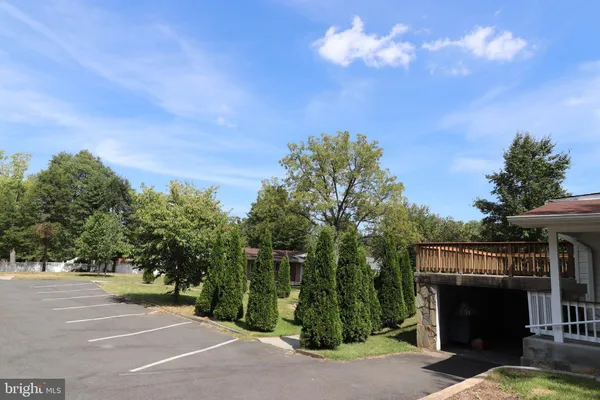 a view of a fire pit and a entertaining space