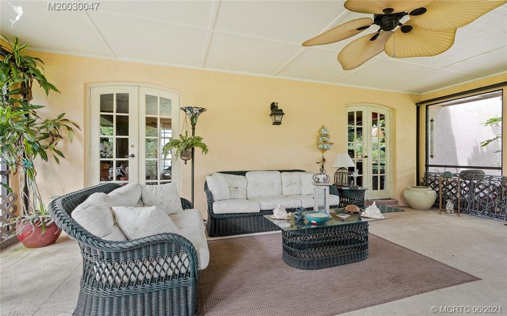 70 North River Road Stuart, FL 34996 - Photo 45 of 56 a living room with furniture and a large window