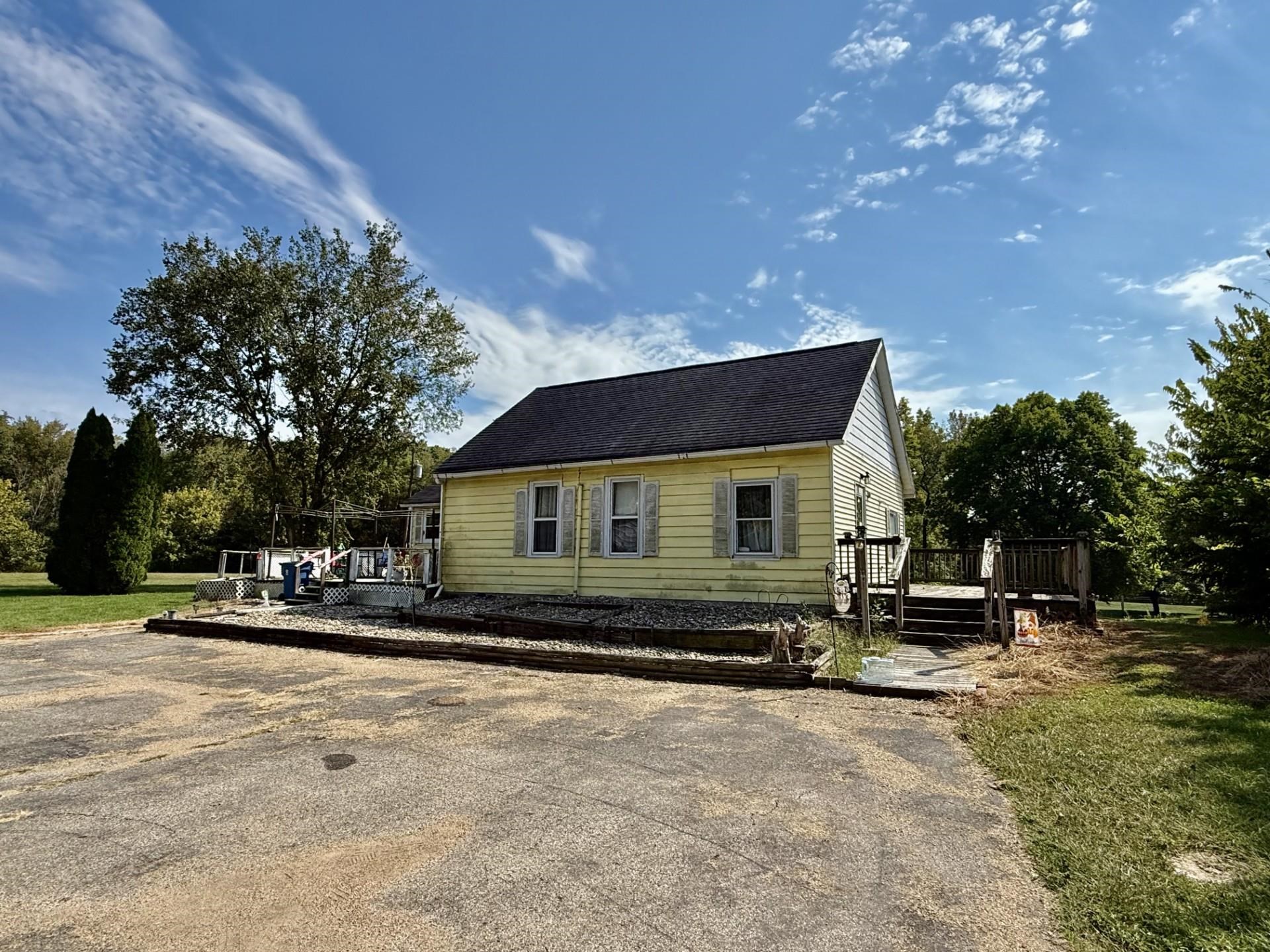 303 North Townline Road Seatonville, IL 61359 - Photo 2 of 7 a front view of a house with a yard