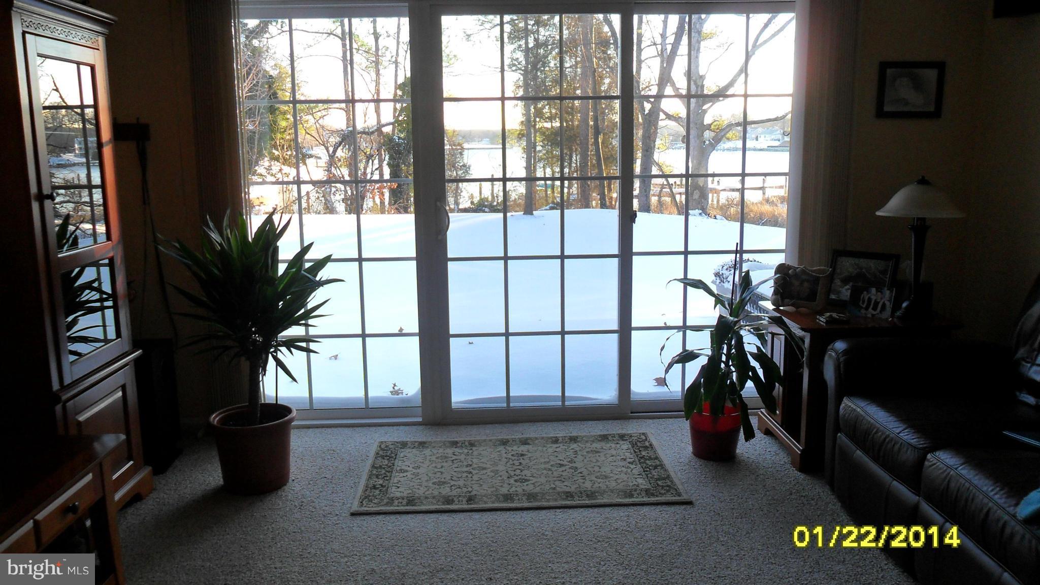 14232 Foxhall Road, Unit 17 Dowell, MD 20629 - Photo 8 of 11 a view of an entryway with a window