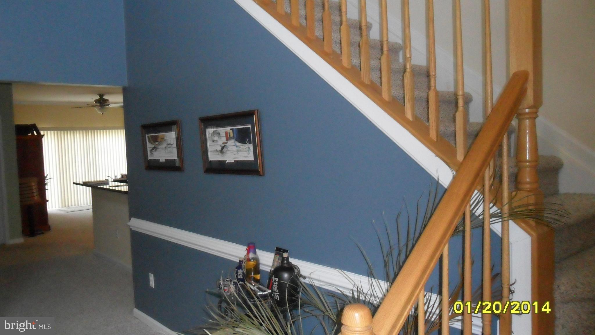 14232 Foxhall Road, Unit 17 Dowell, MD 20629 - Photo 10 of 11 a view of entryway and hall with wooden floor