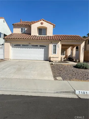a front view of a house with yard