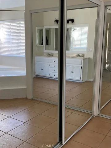 a bathroom with a shower and a sink
