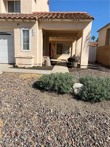a view of a house with a bench