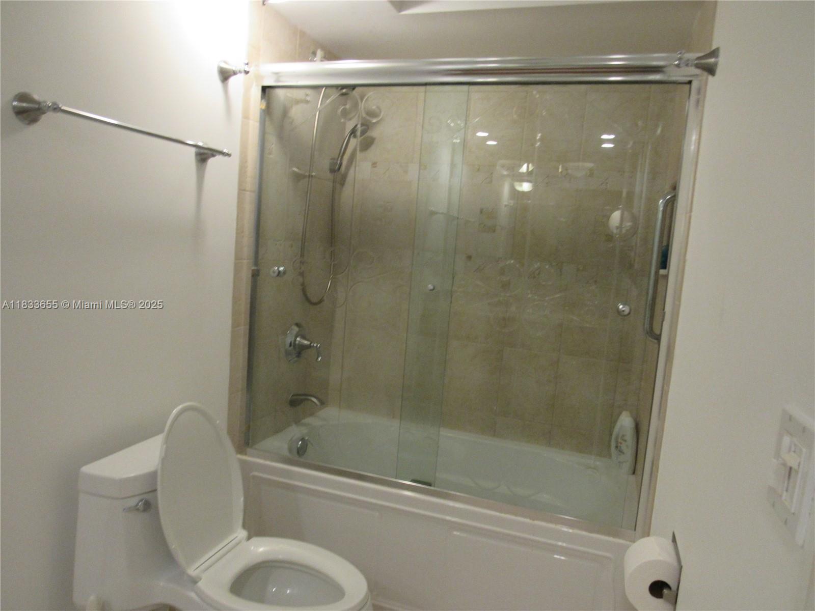 1101 River Reach Drive, Unit 418 Fort Lauderdale, FL 33315 - Photo 15 of 54 a bathroom with a shower and a toilet